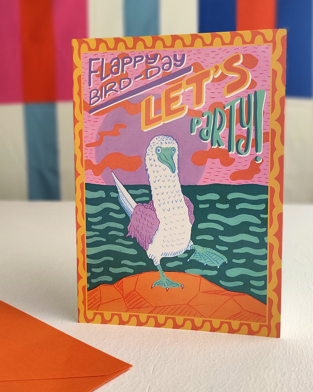 Greetings card with the words Flappy Bird-day Let's Party on the front above a colourful illustration of a Blue-Footed Booby