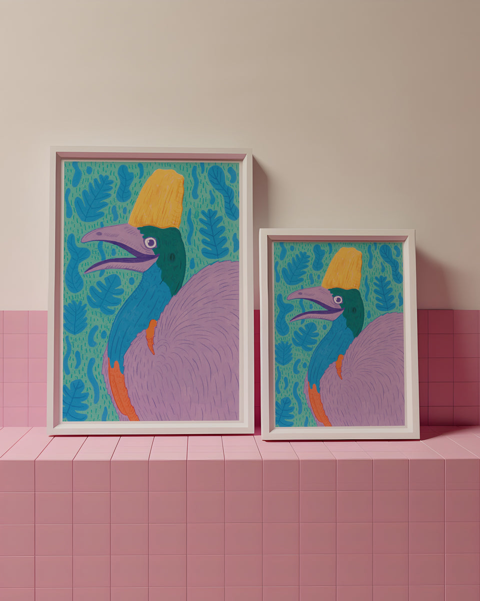 Two colorful framed artworks of a stylized bird on a pink tiled surface with a light pink wall background.