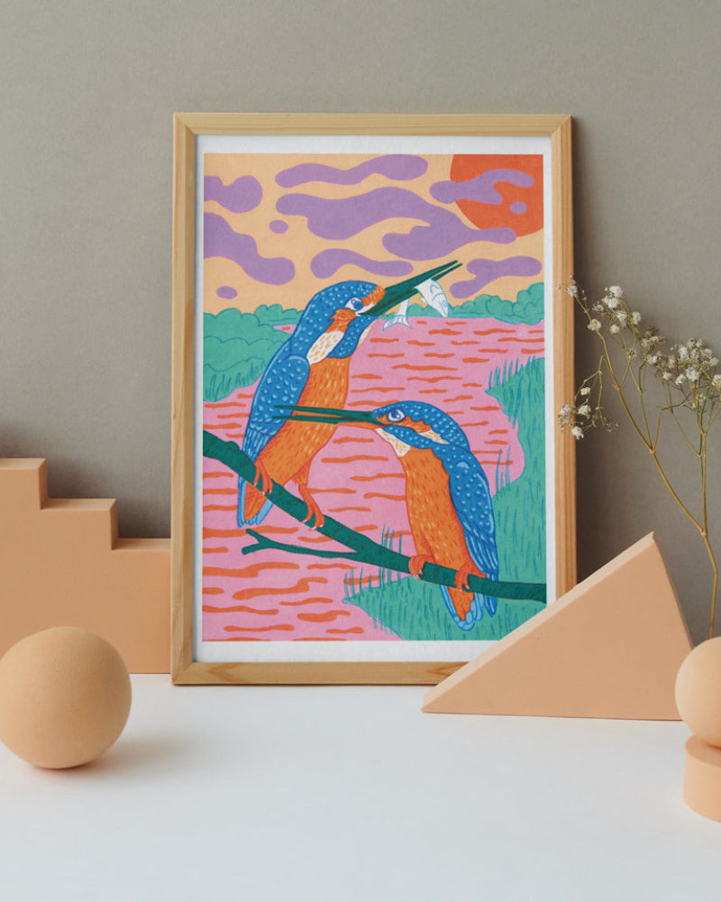 Colorful kingfisher illustration in a wooden frame with geometric shapes and plants on a neutral background